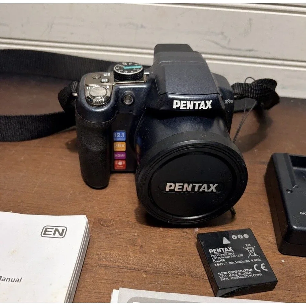 Pentax X90 12.1MP Digital Bridging Camera w/manual, Battery, Charger & Strap
